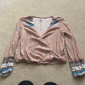 pink blouse with plunging neckline